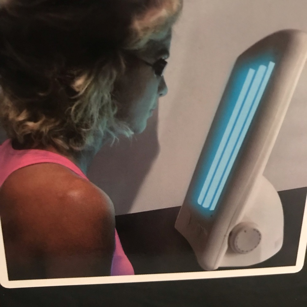 This is a table top mobile facial tanning lamp.